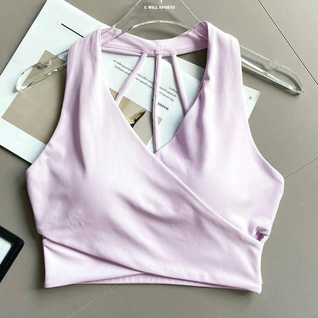 Sujetador deportivo para mujer: sin costuras, con relleno, espalda descubierta, resistente a impactos y estilo crop top; ideal para yoga, gimnasio y fitness.