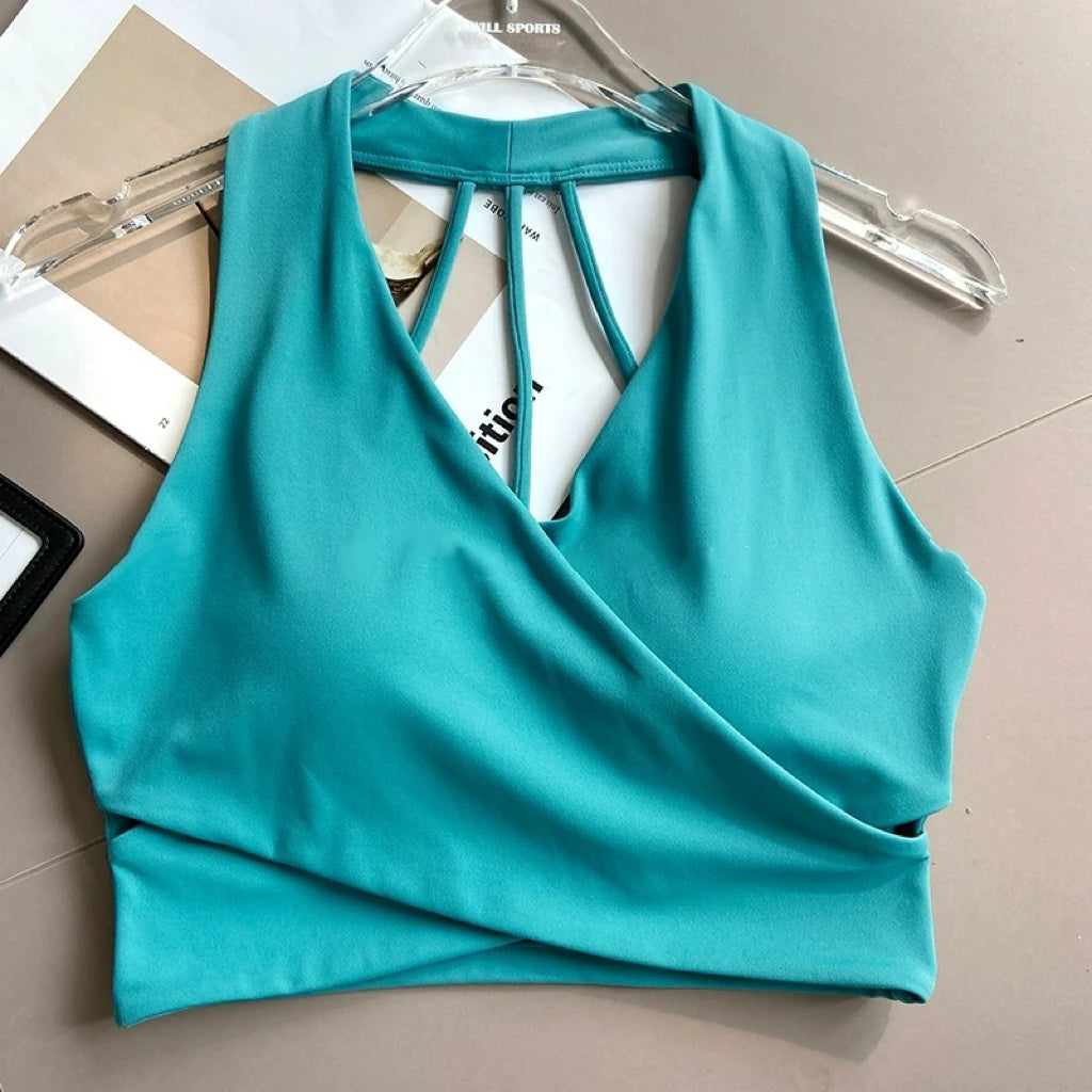 Sujetador deportivo para mujer: sin costuras, con relleno, espalda descubierta, resistente a impactos y estilo crop top; ideal para yoga, gimnasio y fitness.