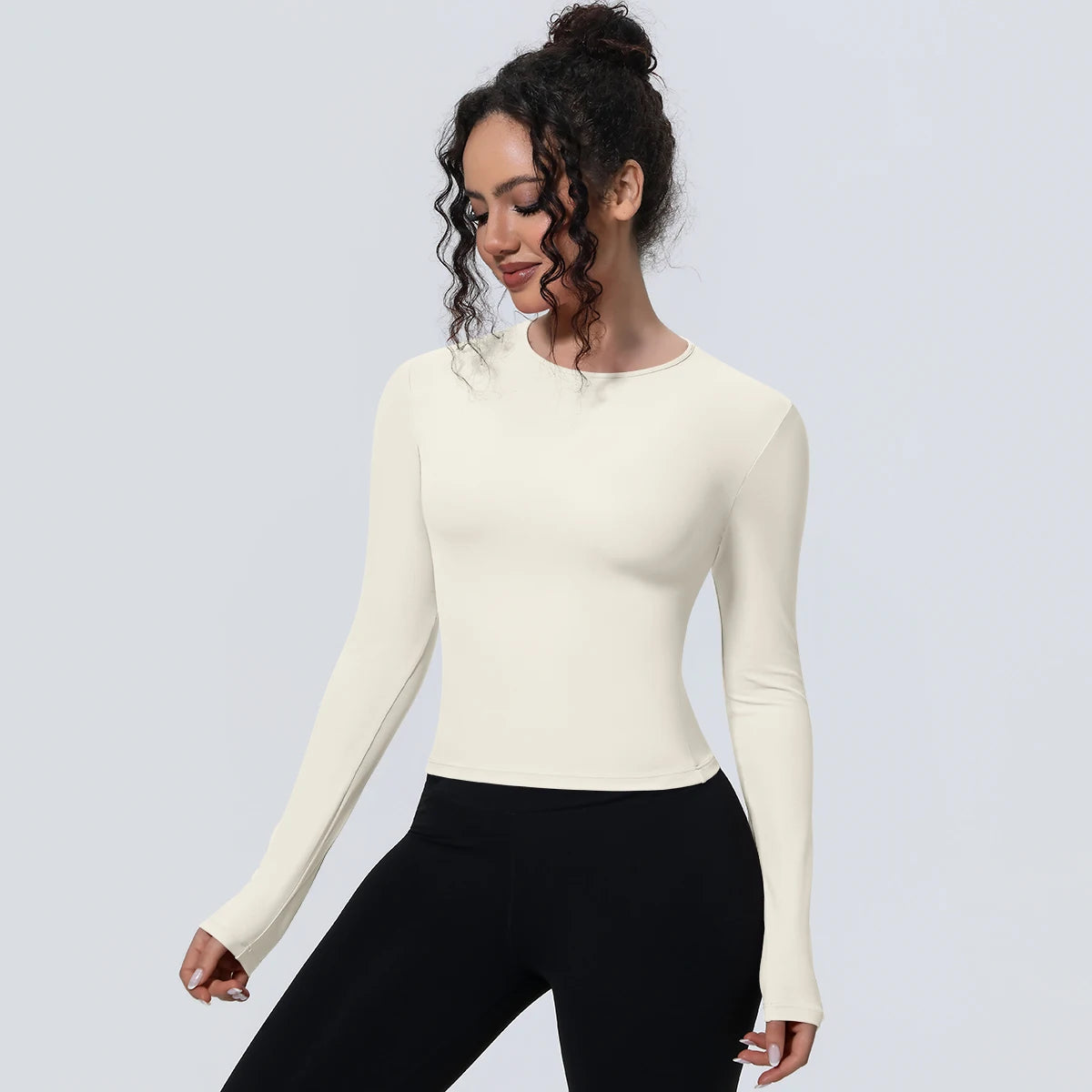 Camiseta de manga larga para mujer: ideal para yoga, gimnasio, deporte y running. Corte entallado, transpirable y de color liso.