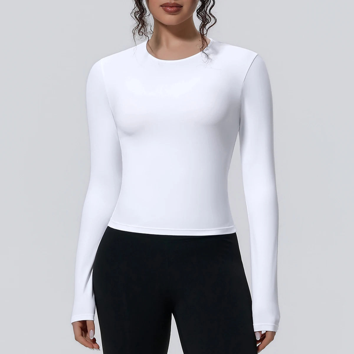 Camiseta de manga larga para mujer: ideal para yoga, gimnasio, deporte y running. Corte entallado, transpirable y de color liso.