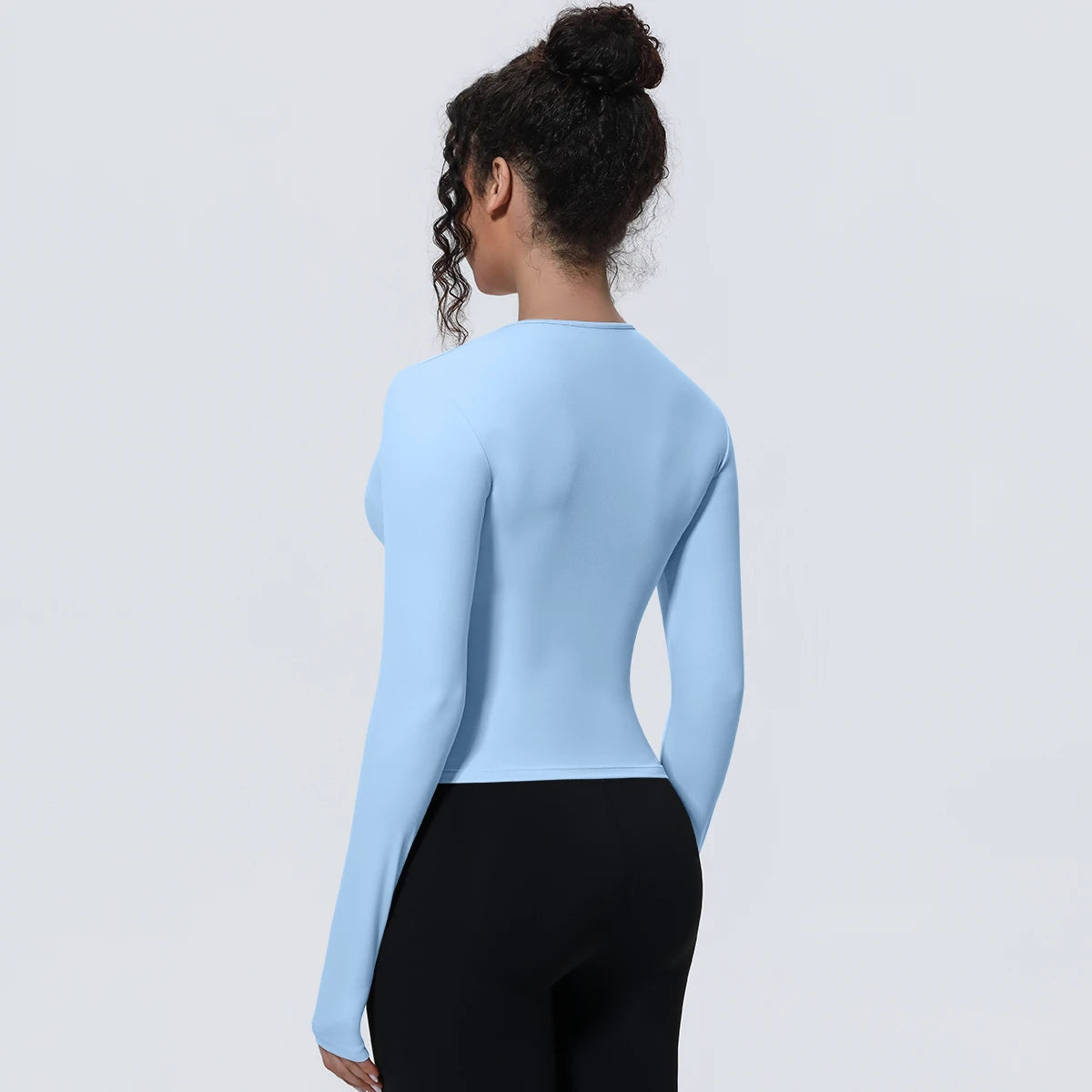 Camiseta de manga larga para mujer: ideal para yoga, gimnasio, deporte y running. Corte entallado, transpirable y de color liso.