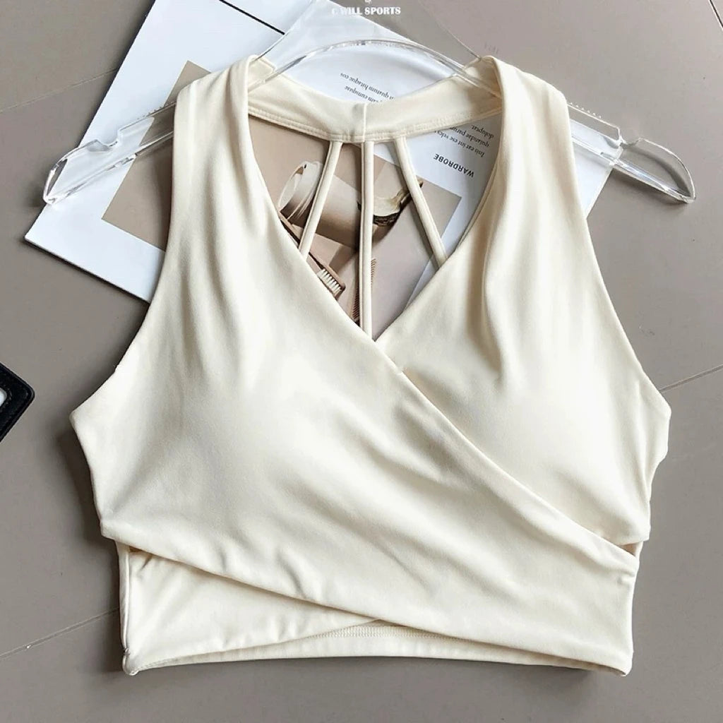 Sujetador deportivo para mujer: sin costuras, con relleno, espalda descubierta, resistente a impactos y estilo crop top; ideal para yoga, gimnasio y fitness.