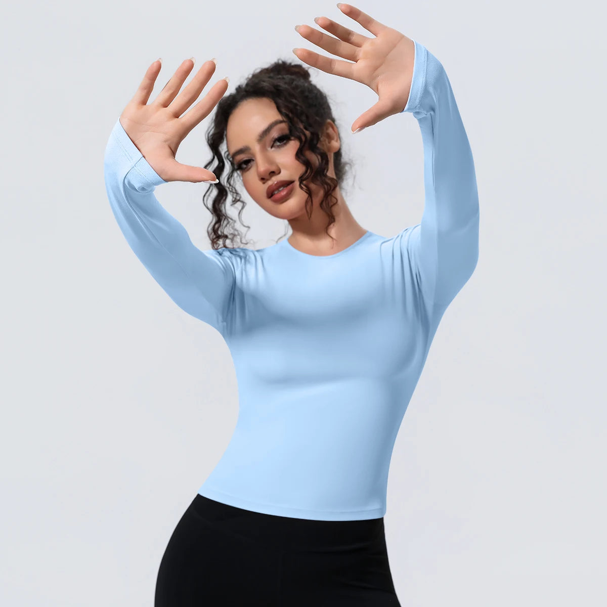 Camiseta de manga larga para mujer: ideal para yoga, gimnasio, deporte y running. Corte entallado, transpirable y de color liso.