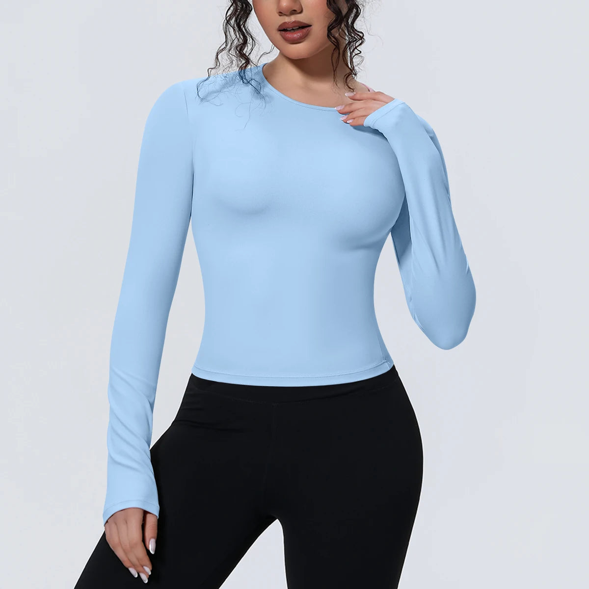 Camiseta de manga larga para mujer: ideal para yoga, gimnasio, deporte y running. Corte entallado, transpirable y de color liso.