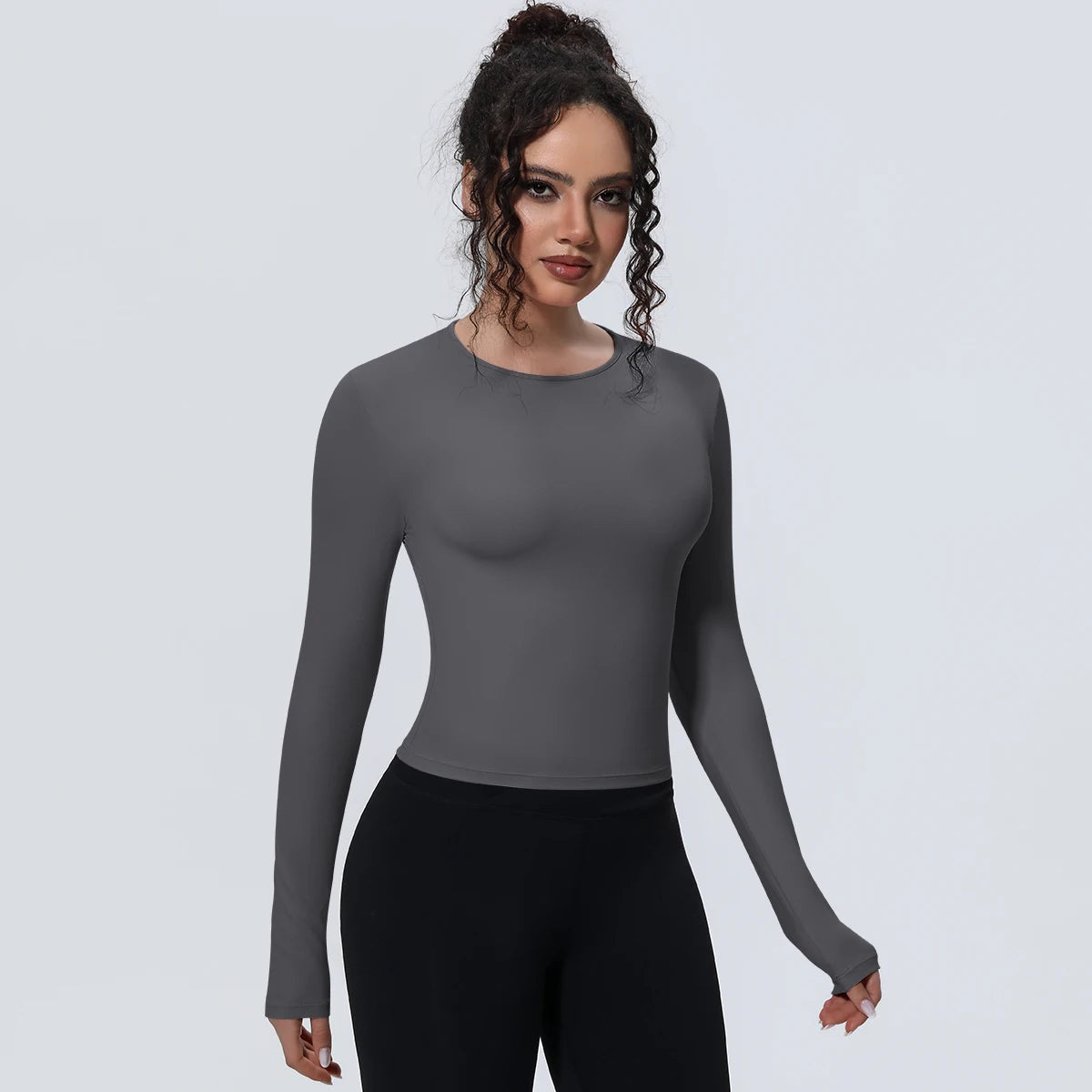 Camiseta de manga larga para mujer: ideal para yoga, gimnasio, deporte y running. Corte entallado, transpirable y de color liso.
