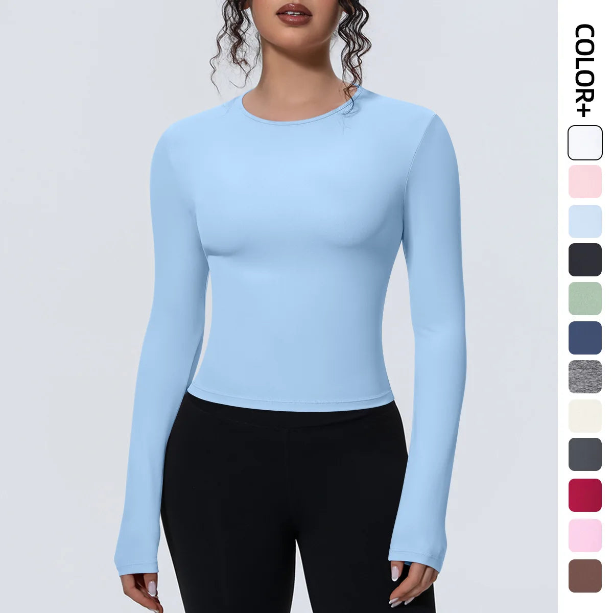 Camiseta de manga larga para mujer: ideal para yoga, gimnasio, deporte y running. Corte entallado, transpirable y de color liso.