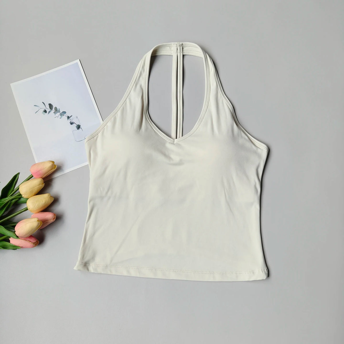 Sujetador deportivo para mujer con cuello en V y diseño halter, espalda atractiva y efecto push-up; ideal para yoga, gimnasio, running y fitness (resistente a impactos).