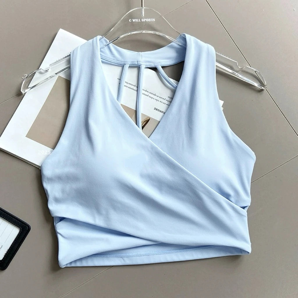 Sujetador deportivo para mujer: sin costuras, con relleno, espalda descubierta, resistente a impactos y estilo crop top; ideal para yoga, gimnasio y fitness.