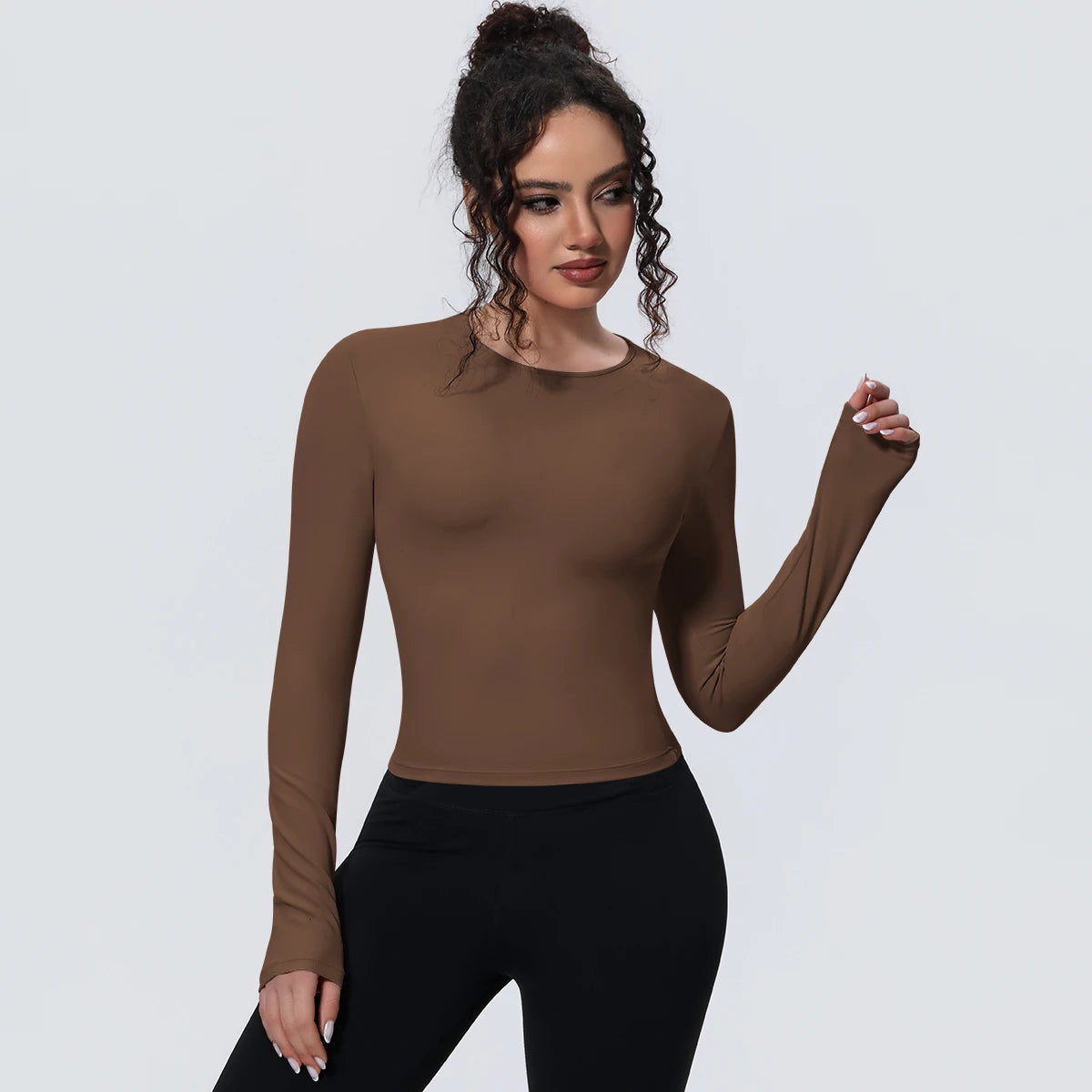 Camiseta de manga larga para mujer: ideal para yoga, gimnasio, deporte y running. Corte entallado, transpirable y de color liso.
